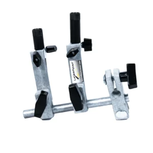 A gray metal laser alignment tool with black knobs.
