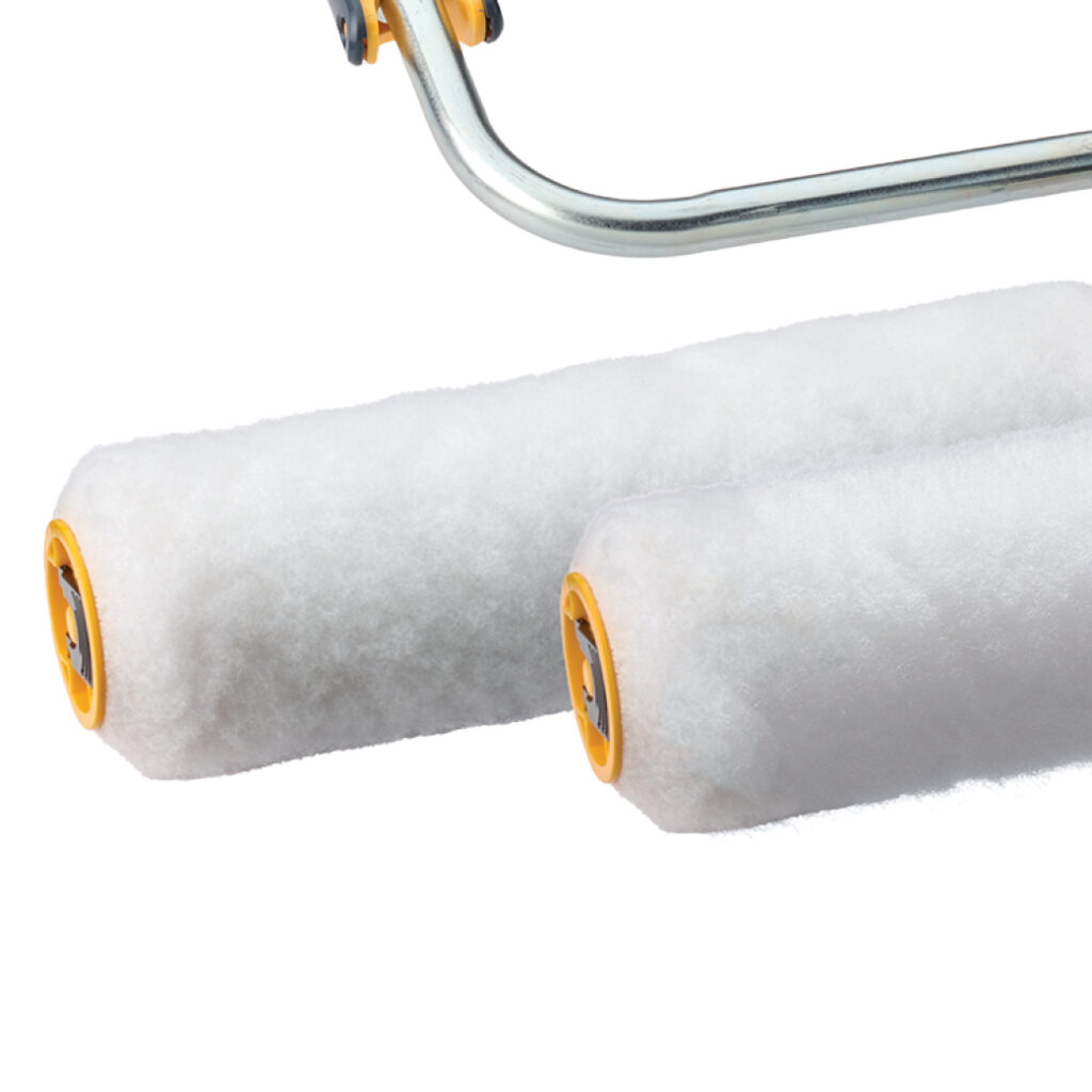 Two white paint roller covers on a metal frame.