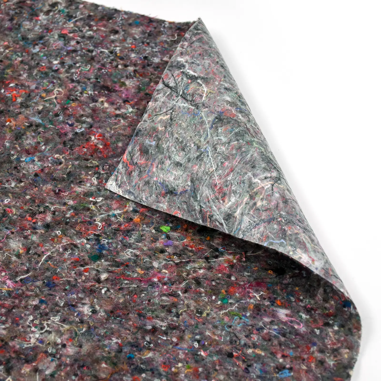 Recycled felt fabric with colorful flecks on white background.